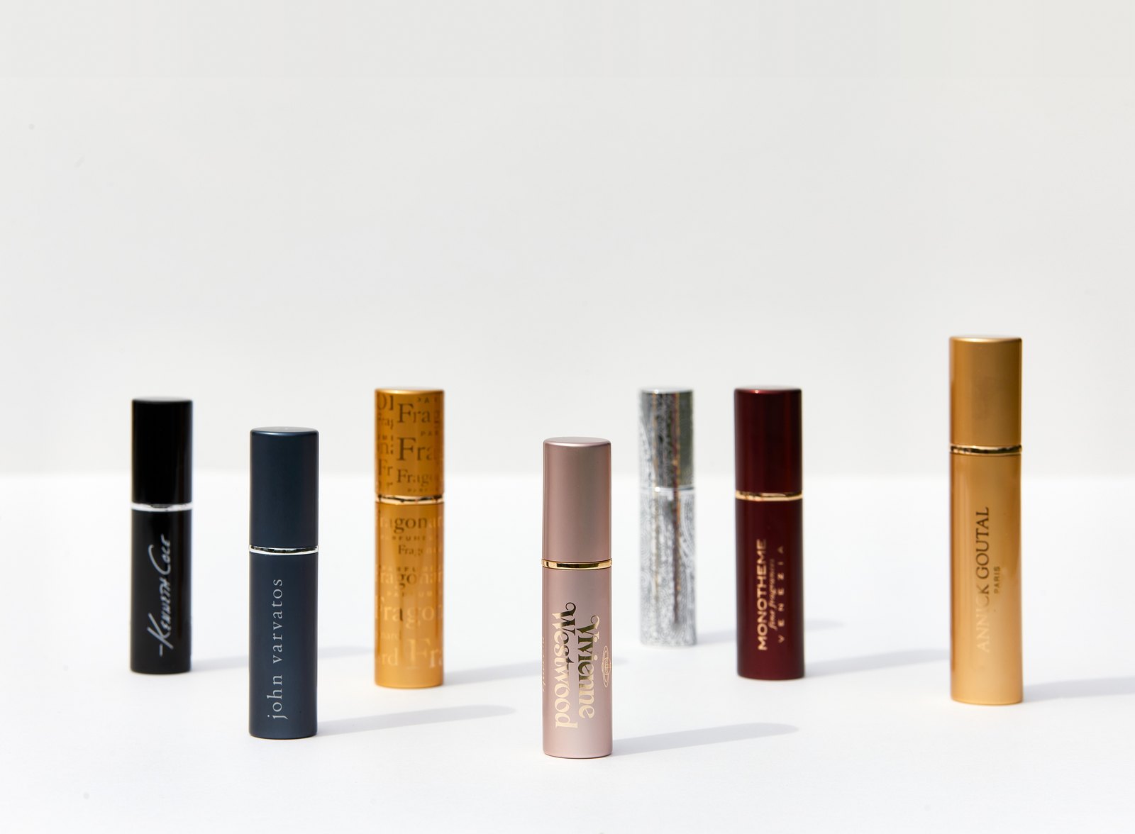 Consistent spray testing — mist being dispensed from an actual perfume bottle